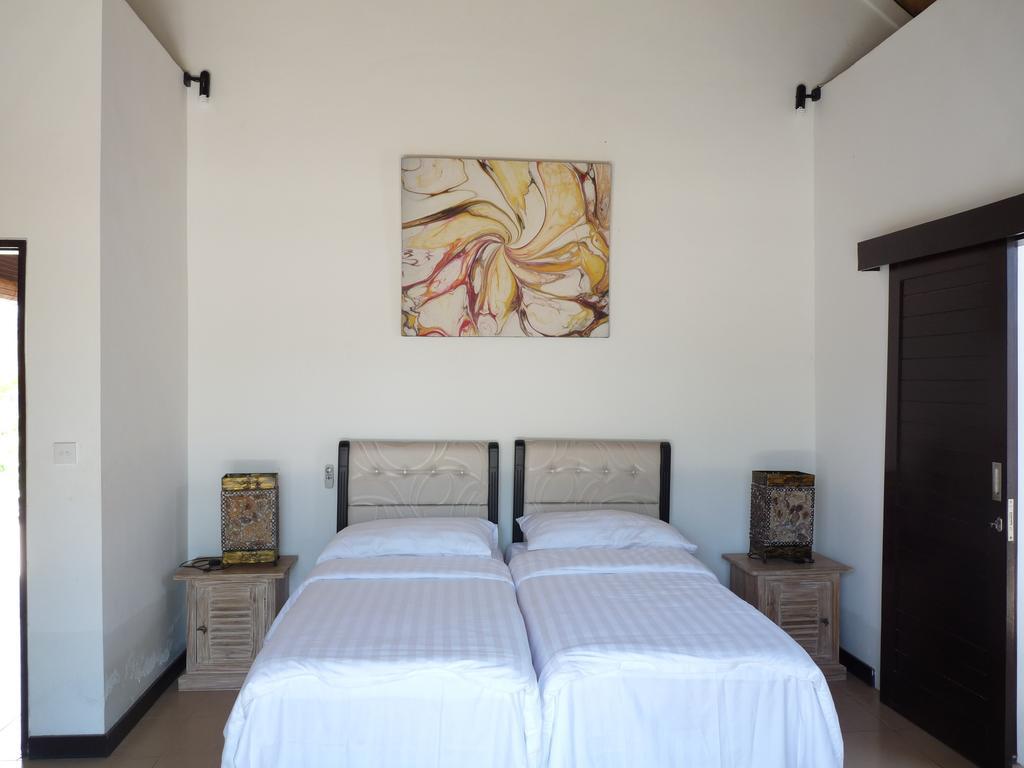 Taman Dewi Sri Villa Et Bungalow بيموتيران الغرفة الصورة